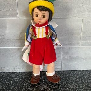 Madame Alexander Doll with Yellow Hat, Red Overalls and Blue Cape